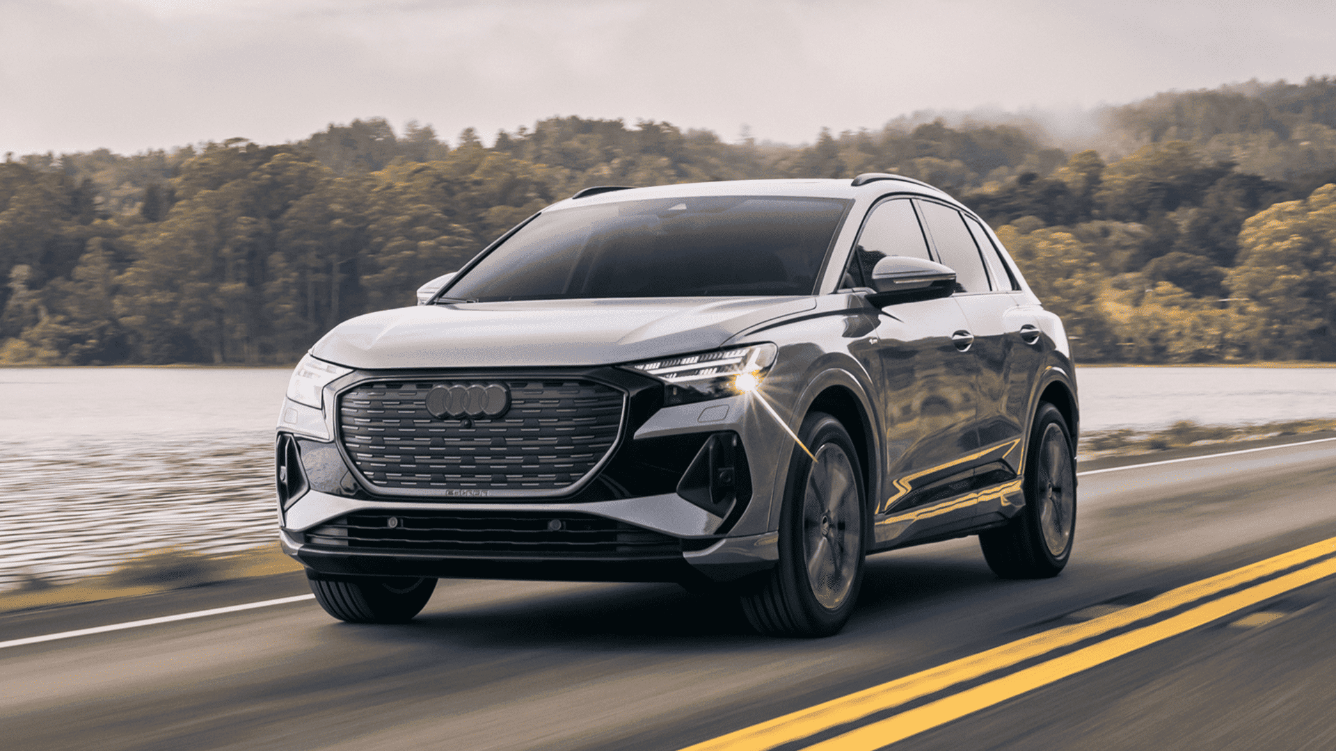 Right profile view of an Audi Q4 etron accelerating.